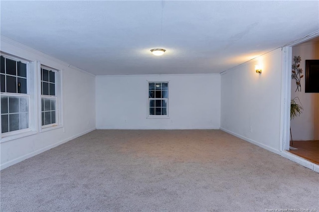 unfurnished room with light carpet