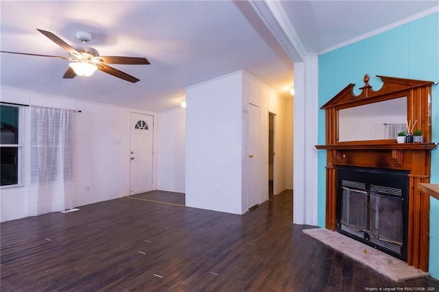 unfurnished living room featuring ceiling fan, ornamental molding, and dark hardwood / wood-style floors