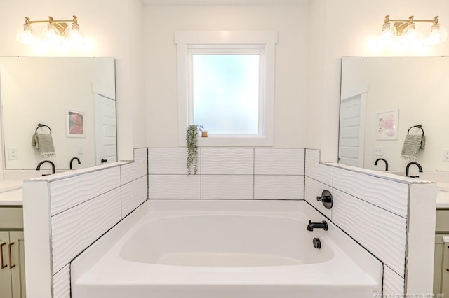 bathroom with a washtub and vanity