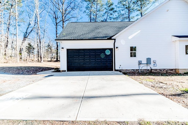 view of side of property with a garage