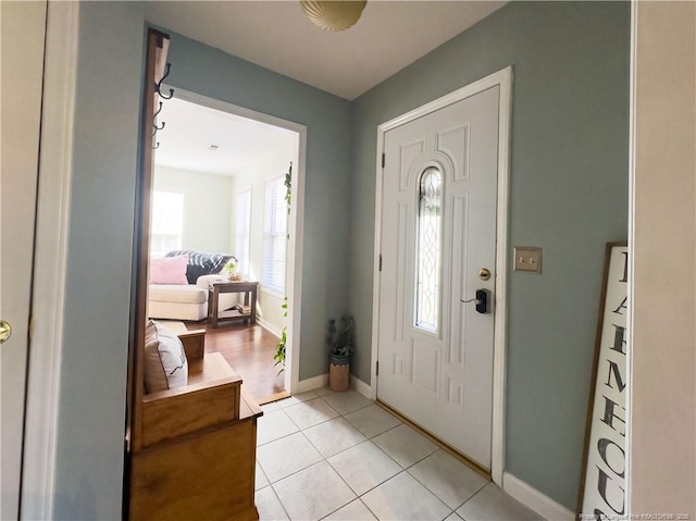 foyer featuring light tile patterned flooring