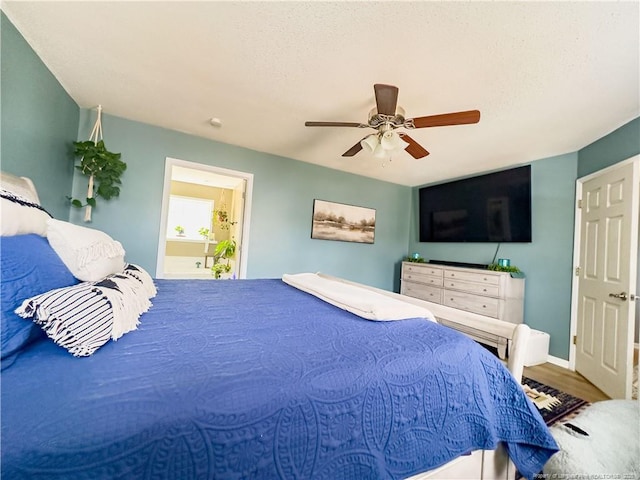 bedroom featuring ceiling fan and hardwood / wood-style flooring