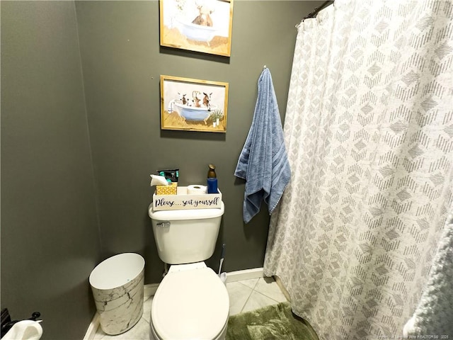 bathroom featuring toilet and tile patterned floors