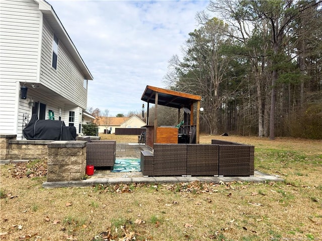 view of yard with a patio and an outdoor living space