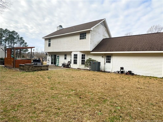 back of house featuring a patio, central AC, and a lawn