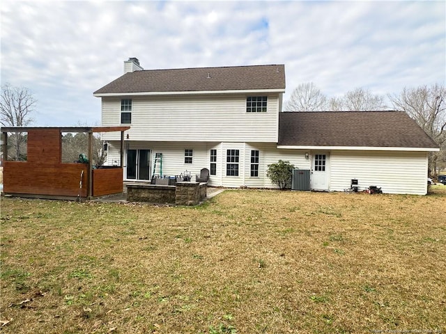 back of property featuring a patio area, central air condition unit, and a lawn