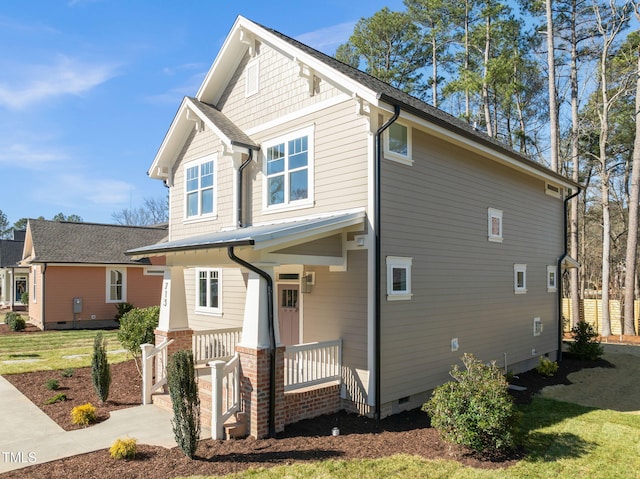 craftsman-style house featuring crawl space and a porch