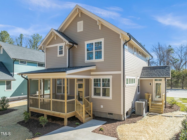 traditional-style house with a shingled roof, cooling unit, and crawl space