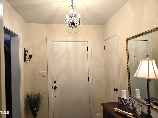 foyer featuring a chandelier