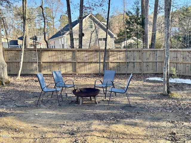 view of yard with a fire pit