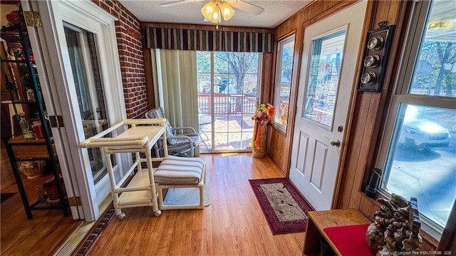 sunroom / solarium with ceiling fan