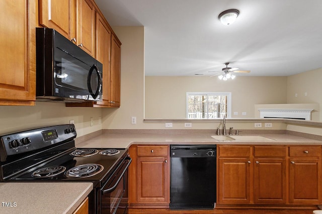 kitchen with ceiling fan, sink, and black appliances