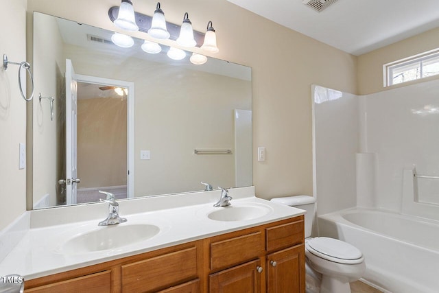 full bathroom featuring toilet,  shower combination, and vanity