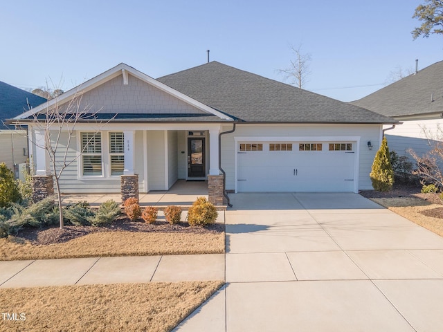 view of front of home featuring a garage and a porch