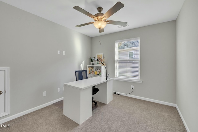 carpeted office with ceiling fan