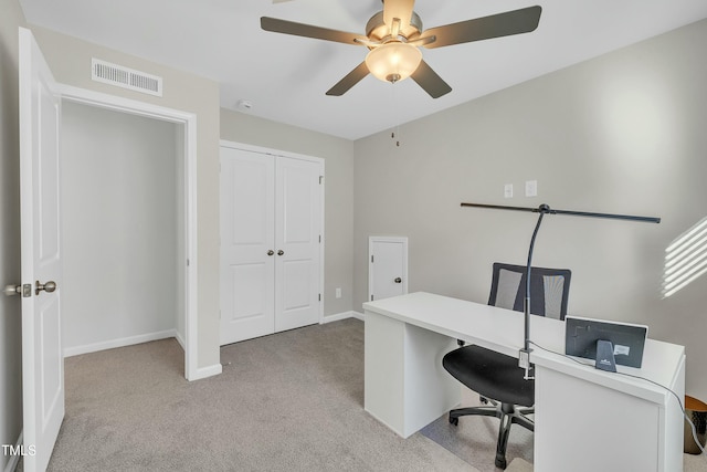 home office with ceiling fan and light colored carpet