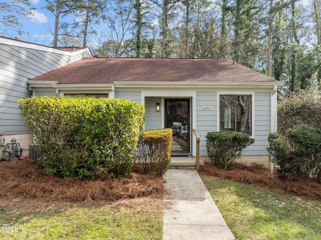 bungalow with a front yard