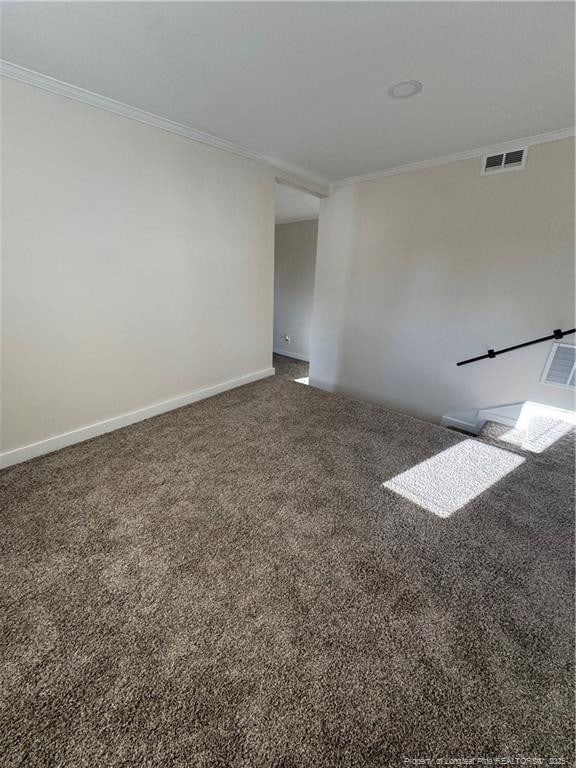 unfurnished room featuring ornamental molding and carpet flooring