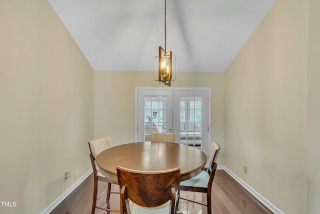 dining space with french doors and light hardwood / wood-style floors