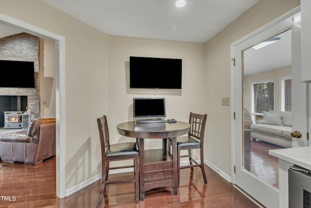 dining room featuring beverage cooler and hardwood / wood-style floors