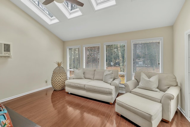 living room featuring ceiling fan, lofted ceiling, and light hardwood / wood-style floors