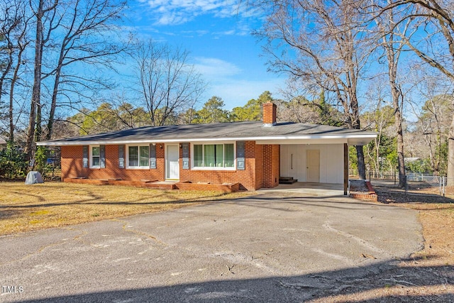 ranch-style home with a carport