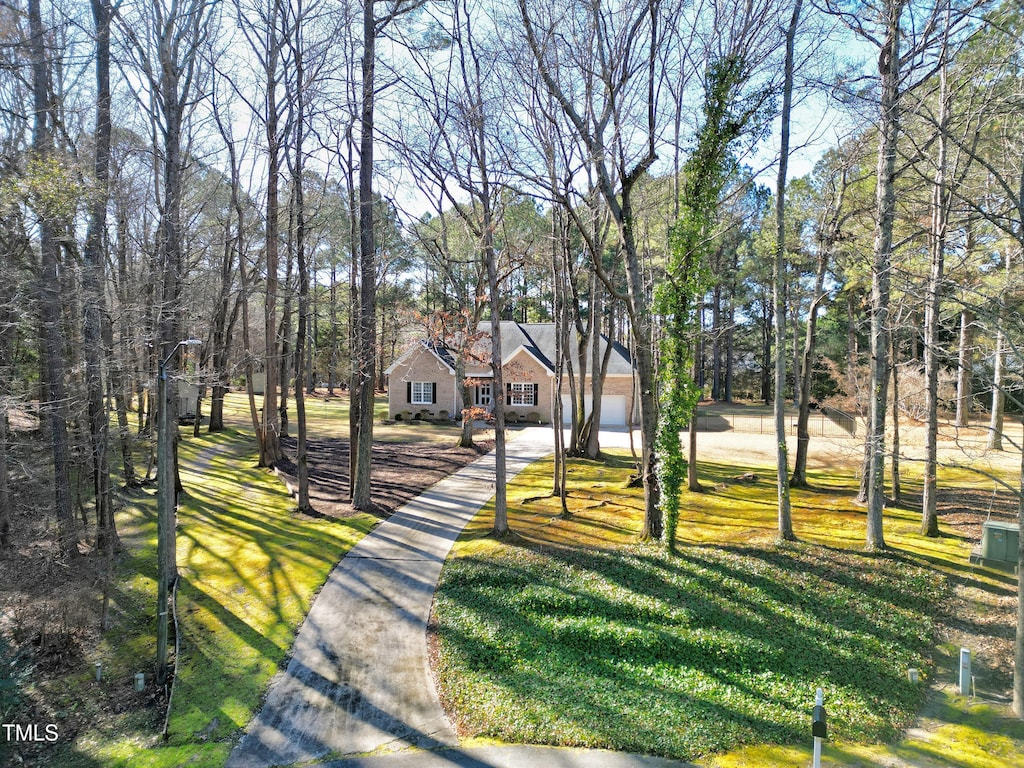 view of home's community featuring a lawn