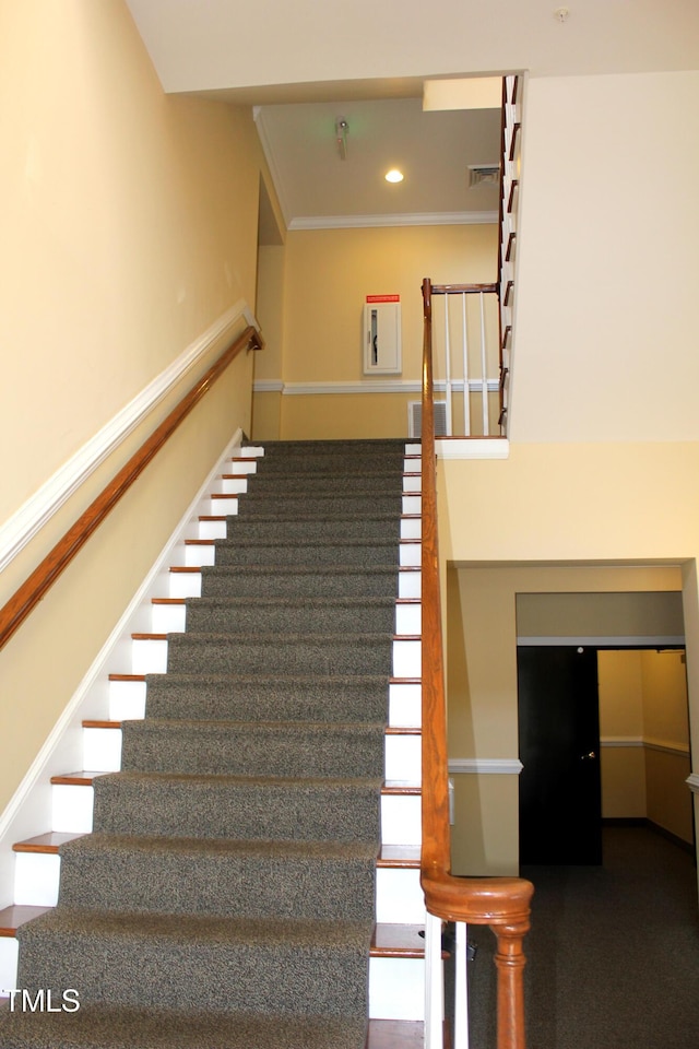 staircase with crown molding