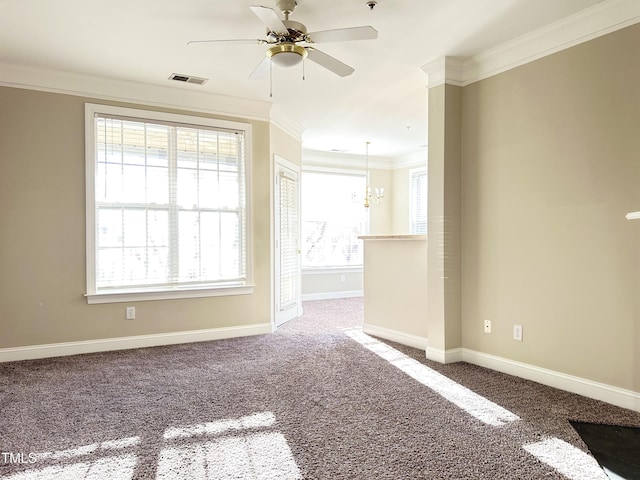 carpeted spare room with crown molding and ceiling fan with notable chandelier