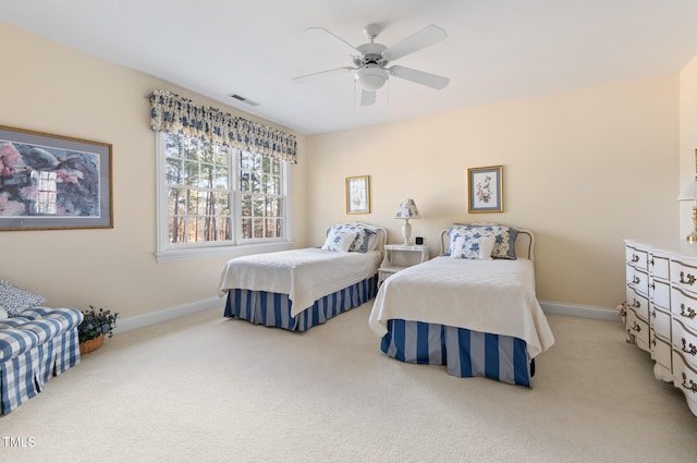 bedroom with light carpet and ceiling fan