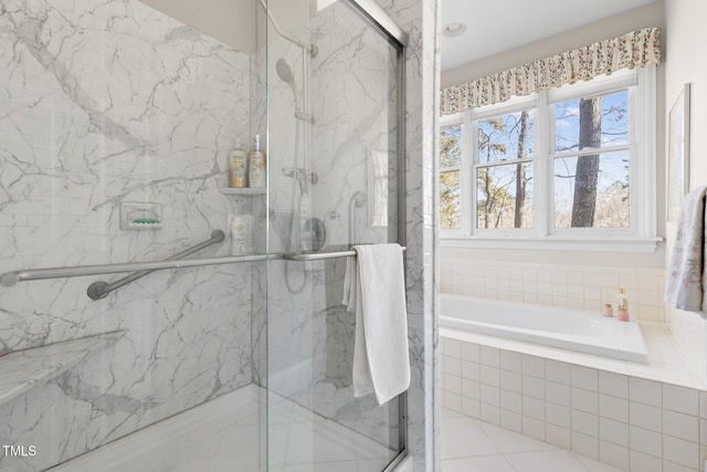 bathroom featuring tile patterned floors and independent shower and bath