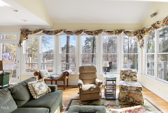 sunroom / solarium with vaulted ceiling and a wealth of natural light