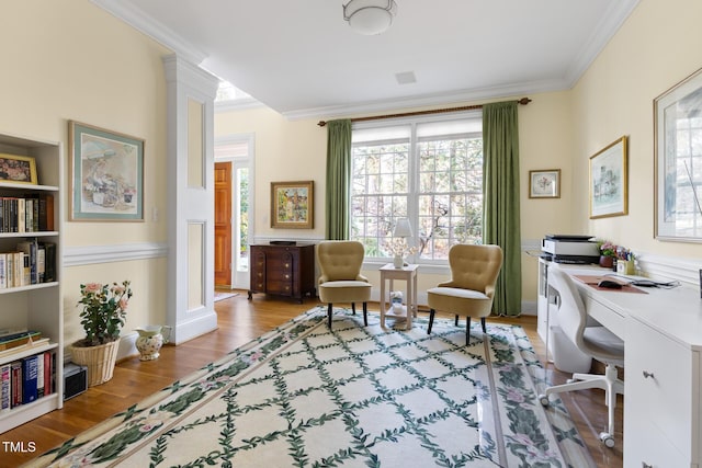 home office with ornamental molding and hardwood / wood-style floors