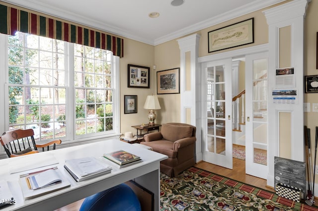 home office with french doors, ornamental molding, and hardwood / wood-style flooring