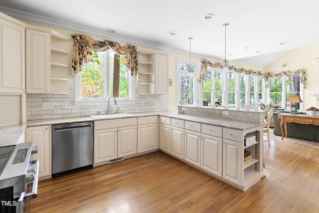 kitchen with a sink, open shelves, light wood finished floors, a peninsula, and stainless steel appliances