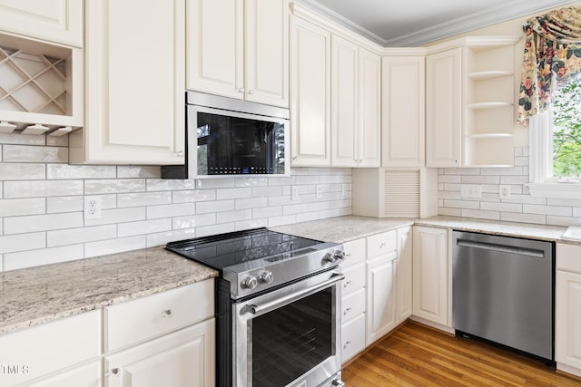 kitchen featuring crown molding, backsplash, open shelves, stainless steel appliances, and light wood-style floors