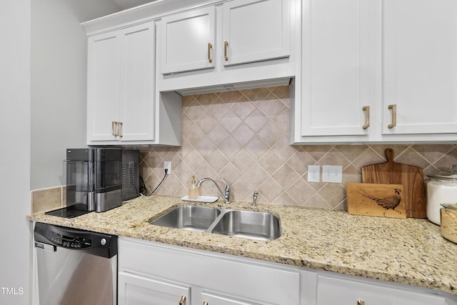 kitchen featuring sink, white cabinets, dishwasher, and tasteful backsplash