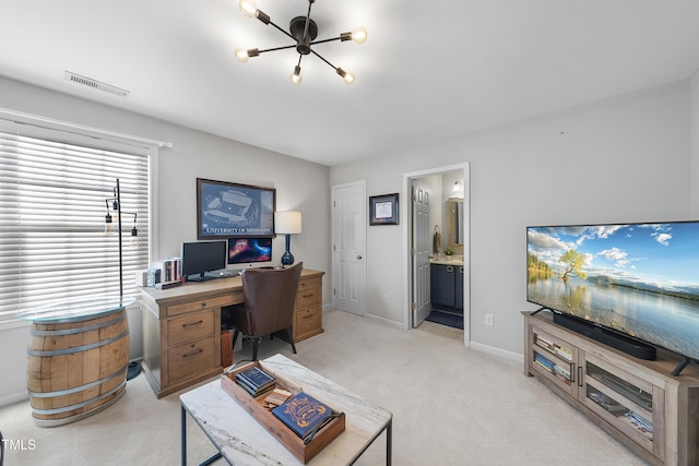 carpeted home office with an inviting chandelier