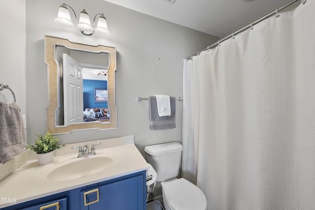 bathroom with toilet and vanity