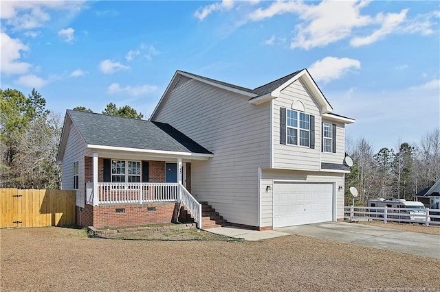 view of front of home with a garage and a porch