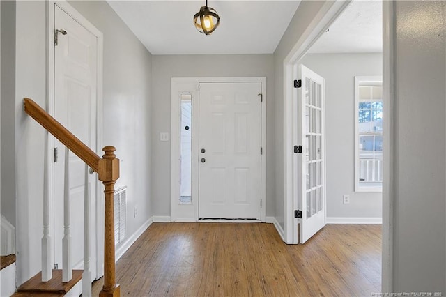 entryway with light hardwood / wood-style flooring