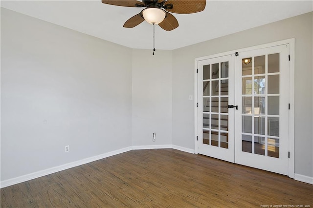 empty room featuring ceiling fan, french doors, and dark hardwood / wood-style floors