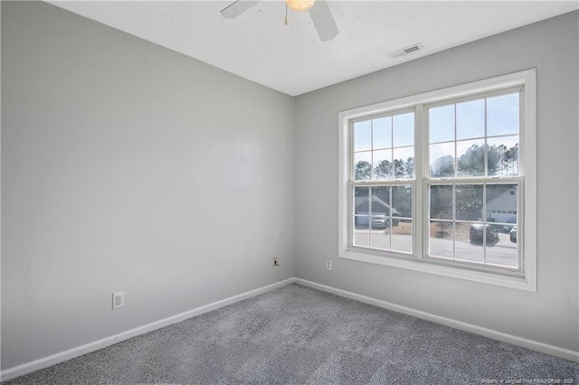 empty room featuring carpet floors and ceiling fan