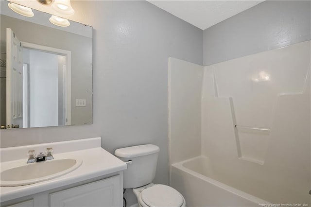 full bathroom featuring toilet, tub / shower combination, and vanity