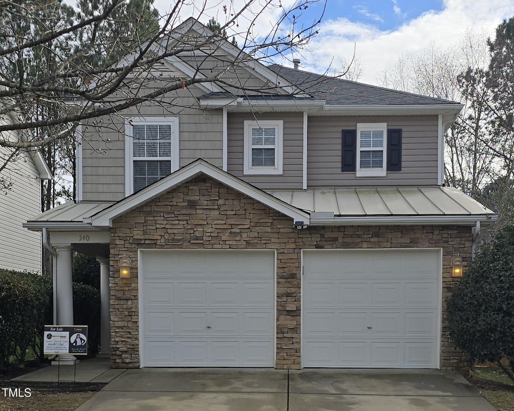 view of front of home with a garage