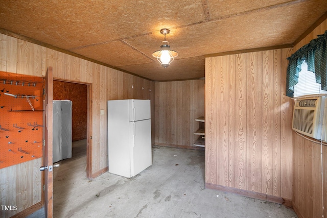 kitchen featuring wooden walls, white refrigerator, concrete floors, and wooden ceiling