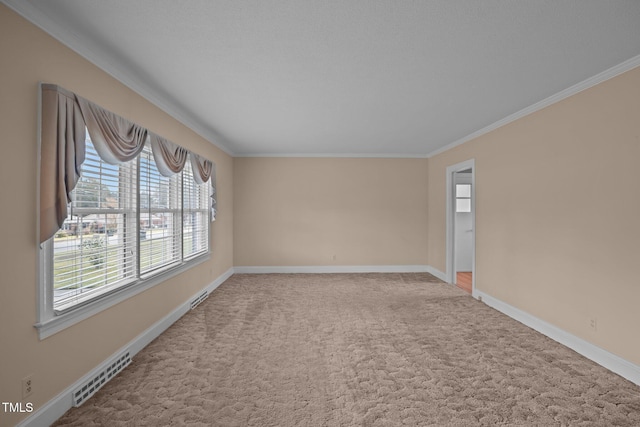 unfurnished room featuring ornamental molding and carpet floors