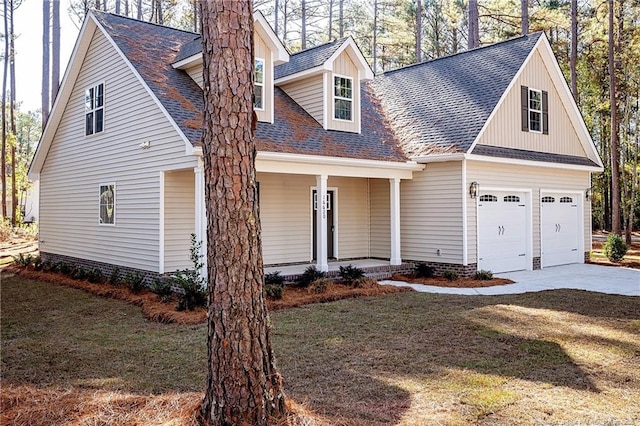 cape cod-style house with a front yard, a porch, and a garage