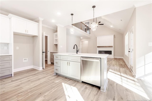 kitchen with dishwasher, white cabinetry, an island with sink, sink, and ceiling fan