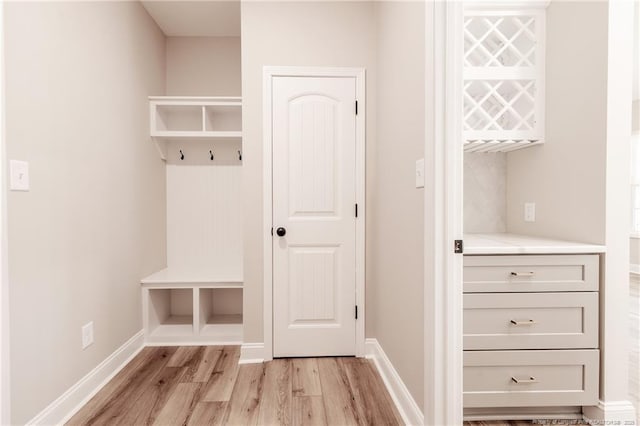 mudroom with light hardwood / wood-style floors